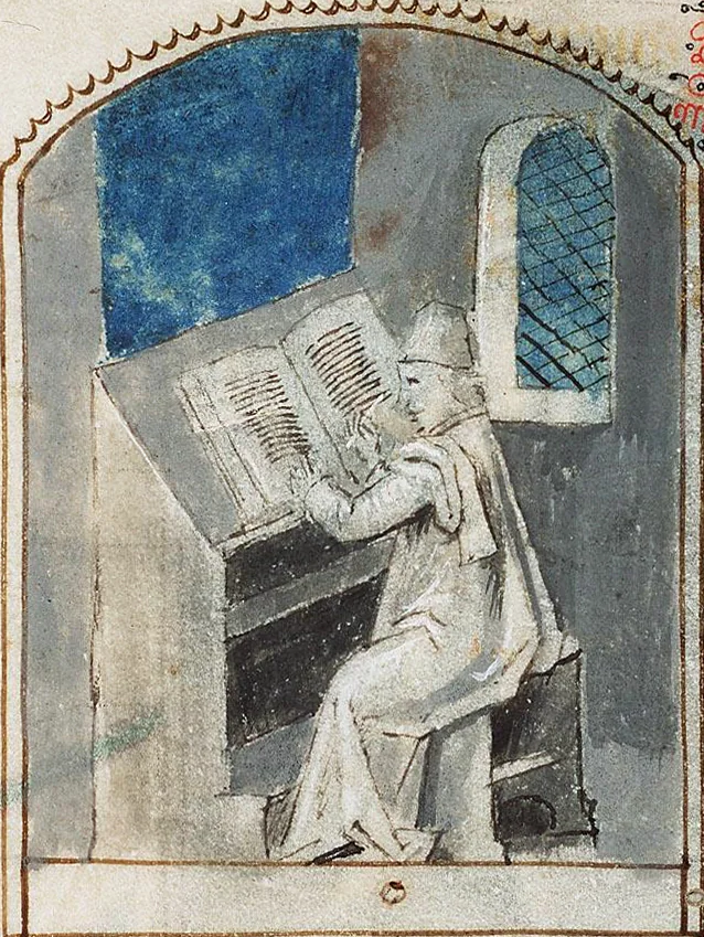 Un scribe médiéval penché sur un manuscrit